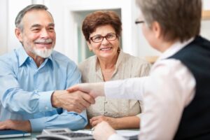 Older couple meeting with a Las Vegas lawyer to plan for debts and estate after death